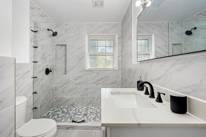 Transform your bathroom with Above All Handyman's expert renovation services in Atlanta. This image showcases a spacious bathroom with a large walk-in shower.